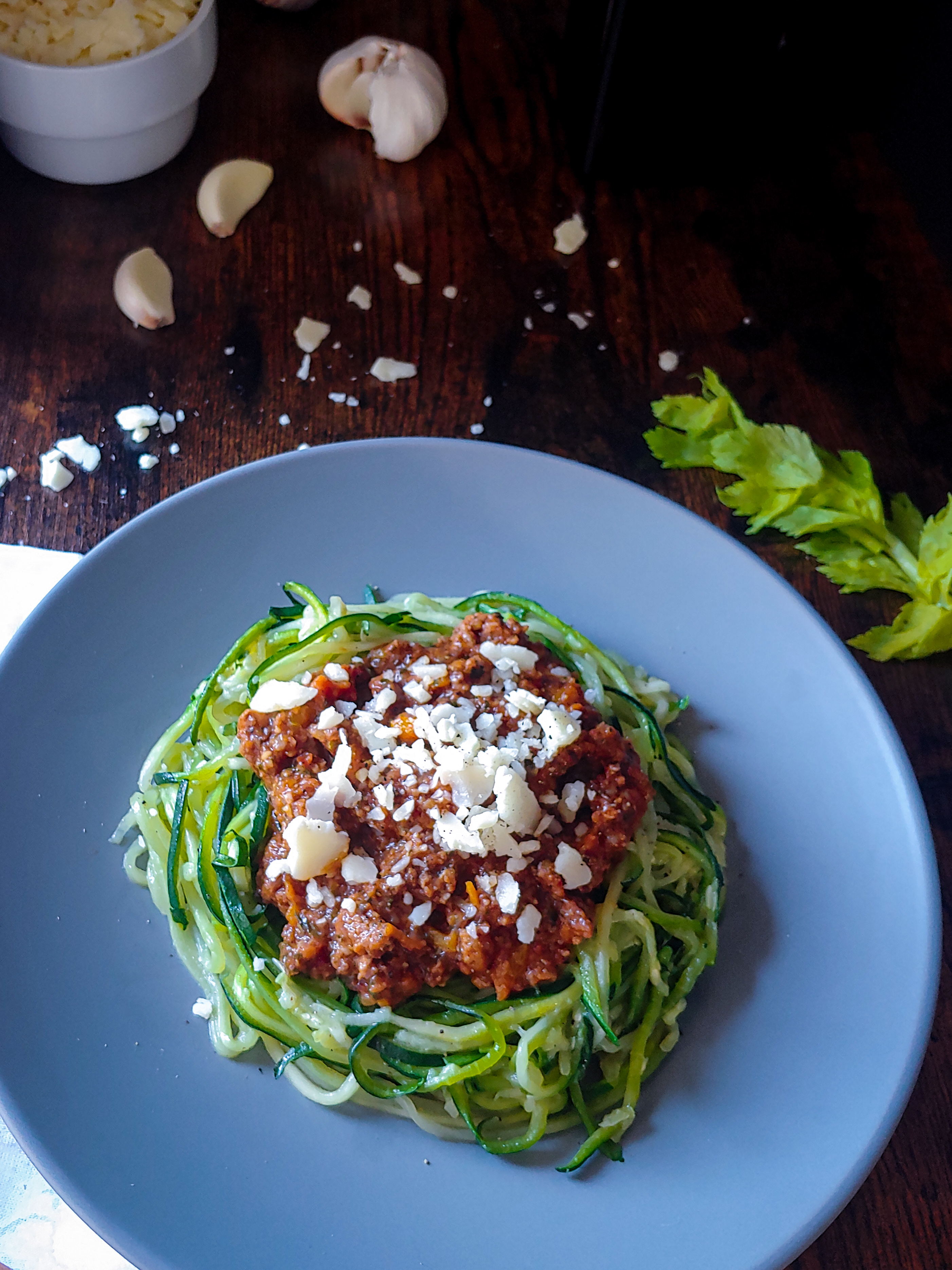 close up of zucchini zoodles with beef pasta sauce and parmesan garlic